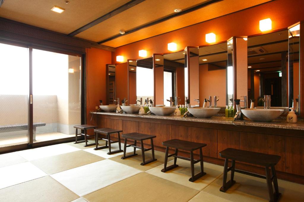 a row of sinks in a public restroom at Takayama Ouan in Takayama