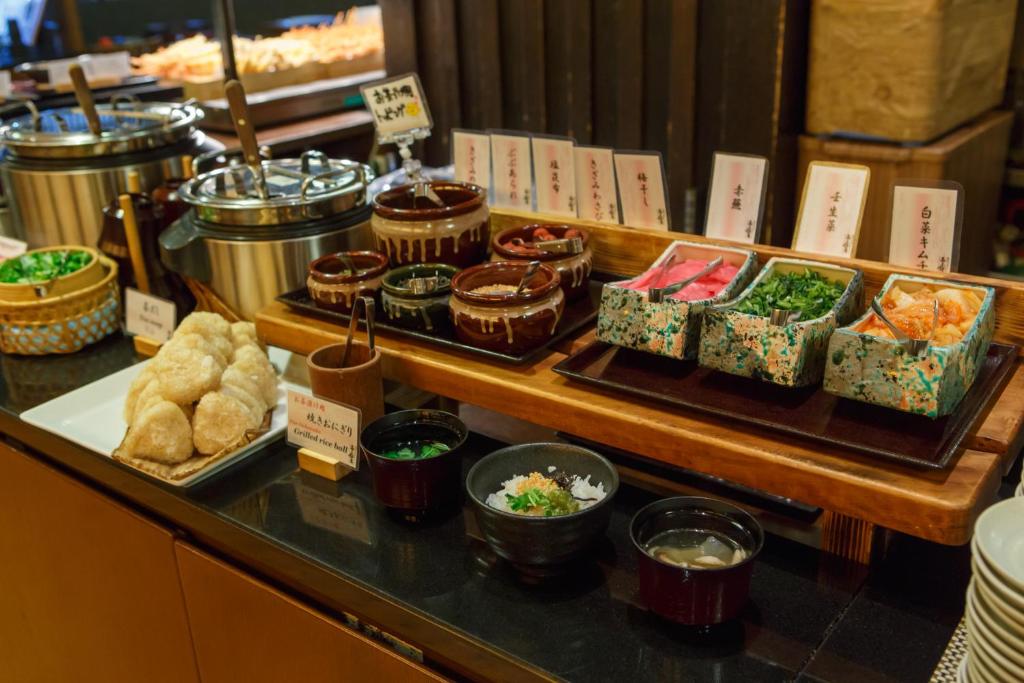 a buffet line with different types of food on display at Takayama Ouan in Takayama