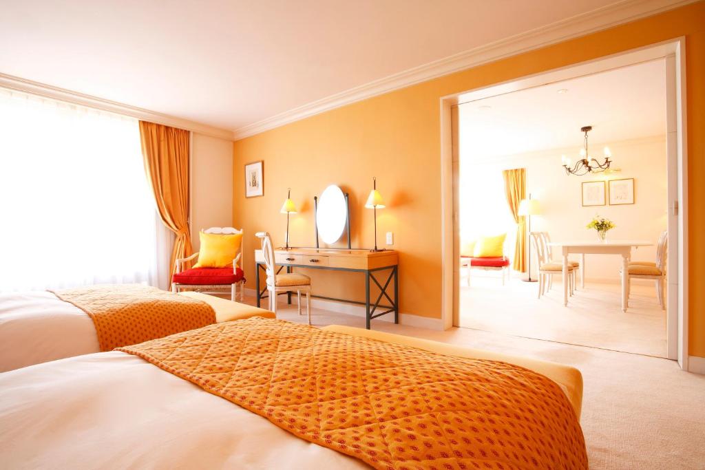 Postel nebo postele na pokoji v ubytování L'Hotel de Hiei