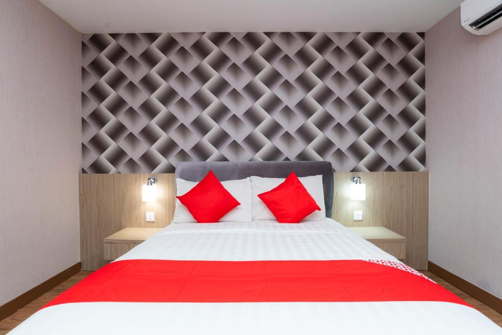 Postel nebo postele na pokoji v ubytování Hotel 101 Ulu Tiram