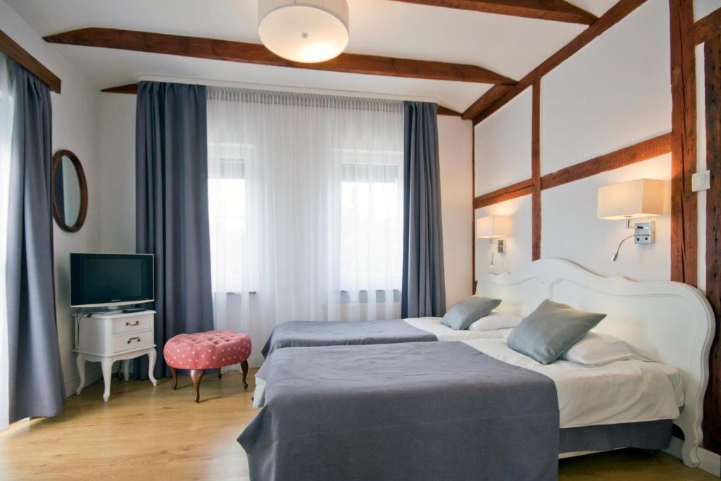 Ein Bett oder Betten in einem Zimmer der Unterkunft Meduza Hotel &amp; Spa