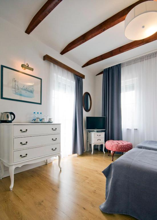 Postel nebo postele na pokoji v ubytování Meduza Hotel & Spa