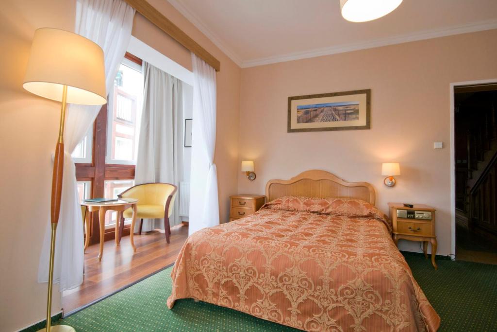 Ein Bett oder Betten in einem Zimmer der Unterkunft Meduza Hotel &amp; Spa