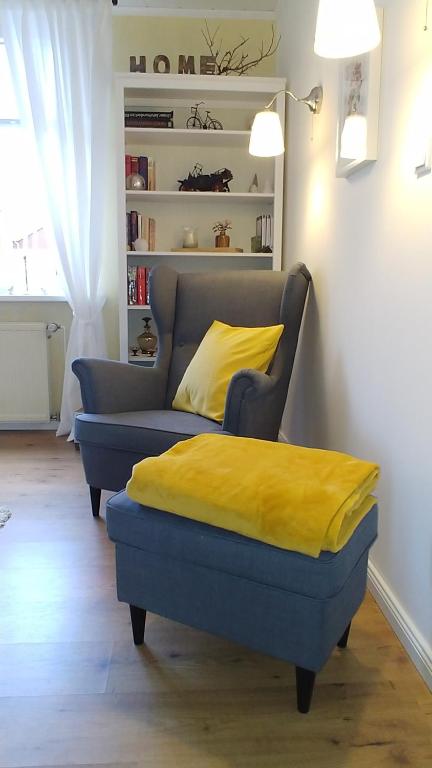 a bed and a couch in a room at An der Bremke in Herzberg am Harz