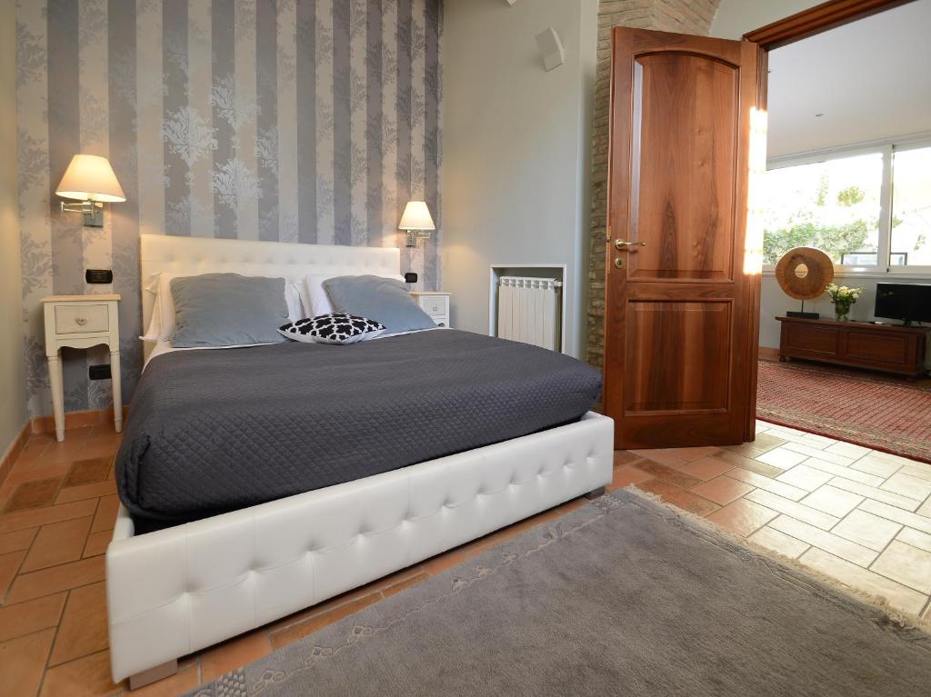 A bed or beds in a room at Divine Stylish Apartment