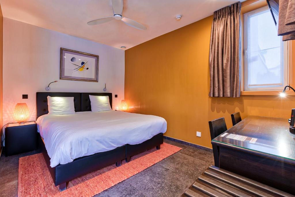 Cama o camas de una habitación en Hotel Astoria Gent
