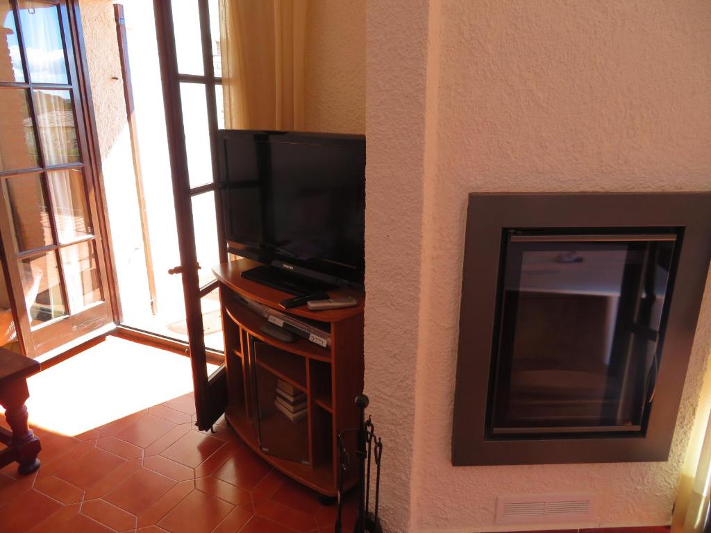 Televízia a/alebo spoločenská miestnosť v ubytovaní Torre Vella 207
