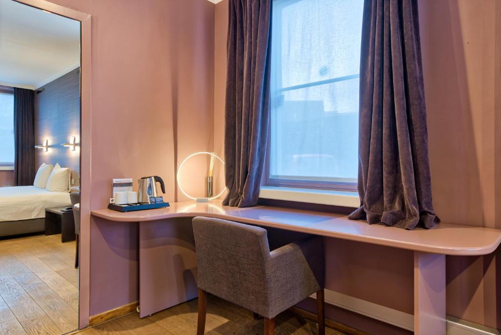 Cama o camas de una habitación en Hotel Astoria Gent