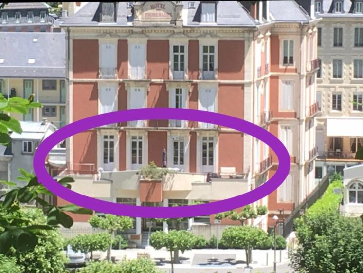 a purple circle in front of a building at Résidence Regina in Cauterets