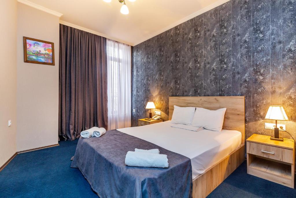 Postel nebo postele na pokoji v ubytování Hotel Marlyn