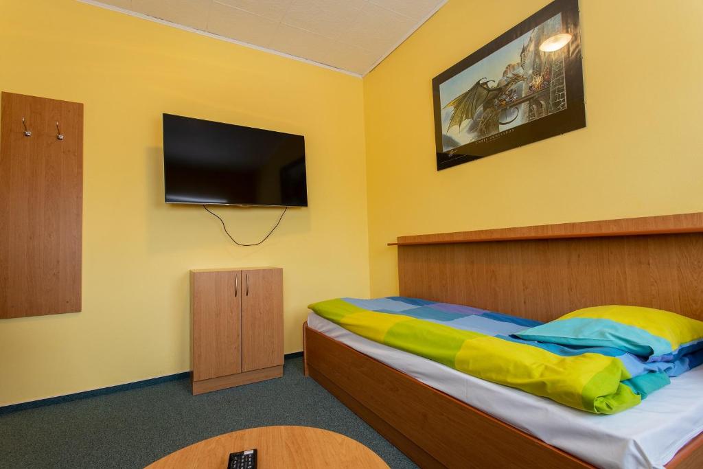 Postel nebo postele na pokoji v ubytování Penzion Školička