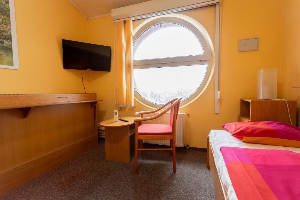 Postel nebo postele na pokoji v ubytování Penzion Školička