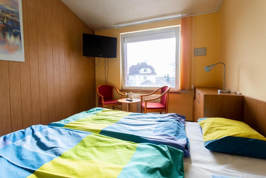 Postel nebo postele na pokoji v ubytování Penzion Školička