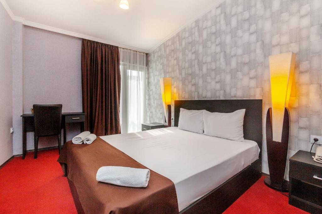 Postel nebo postele na pokoji v ubytování Hotel Marlyn