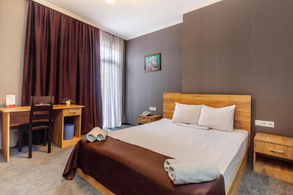 Postel nebo postele na pokoji v ubytování Hotel Marlyn