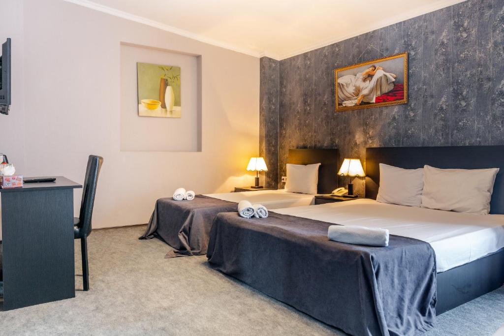 Postel nebo postele na pokoji v ubytování Hotel Marlyn