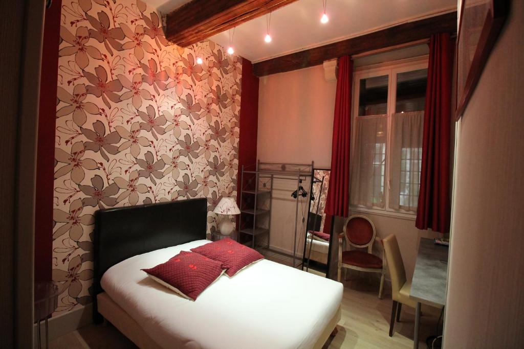 Postel nebo postele na pokoji v ubytování Hotel Le Jacquemart