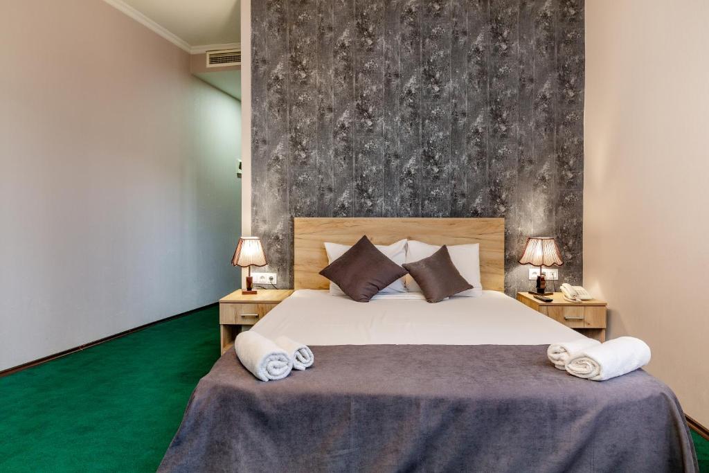 Postel nebo postele na pokoji v ubytování Hotel Marlyn