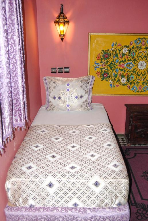 Postel nebo postele na pokoji v ubytování Riad El Bacha