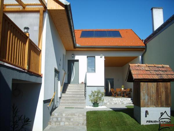 a house with a staircase and a house with a roof at Ferienhaus Werner in Mönchhof