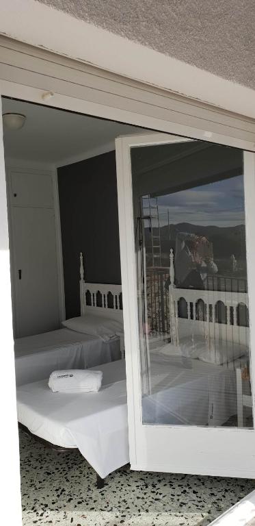 Posteľ alebo postele v izbe v ubytovaní El Pas, Apartamento con vistas al mar L1