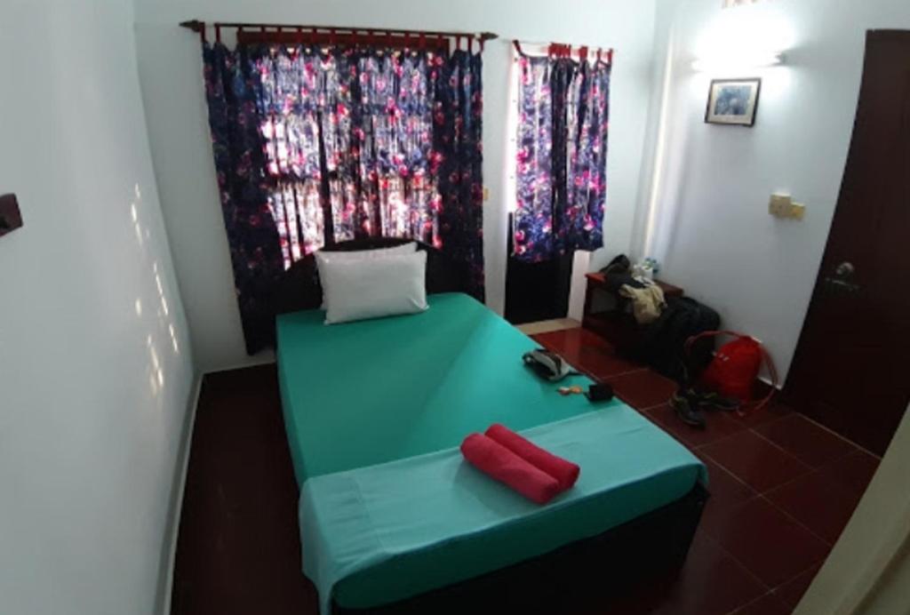 Postel nebo postele na pokoji v ubytování Smiley's Guesthouse