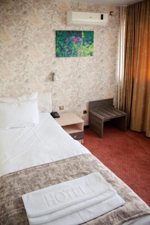Postel nebo postele na pokoji v ubytování Hotel Livade