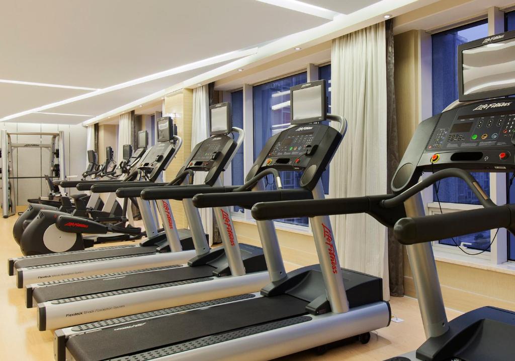 a row of treadmill machines in a gym at Crowne Plaza Nanjing Jiangning, an IHG Hotel in Nanjing