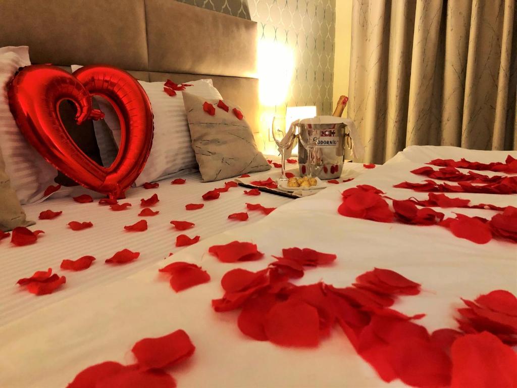 Postel nebo postele na pokoji v ubytování Hotel Baron