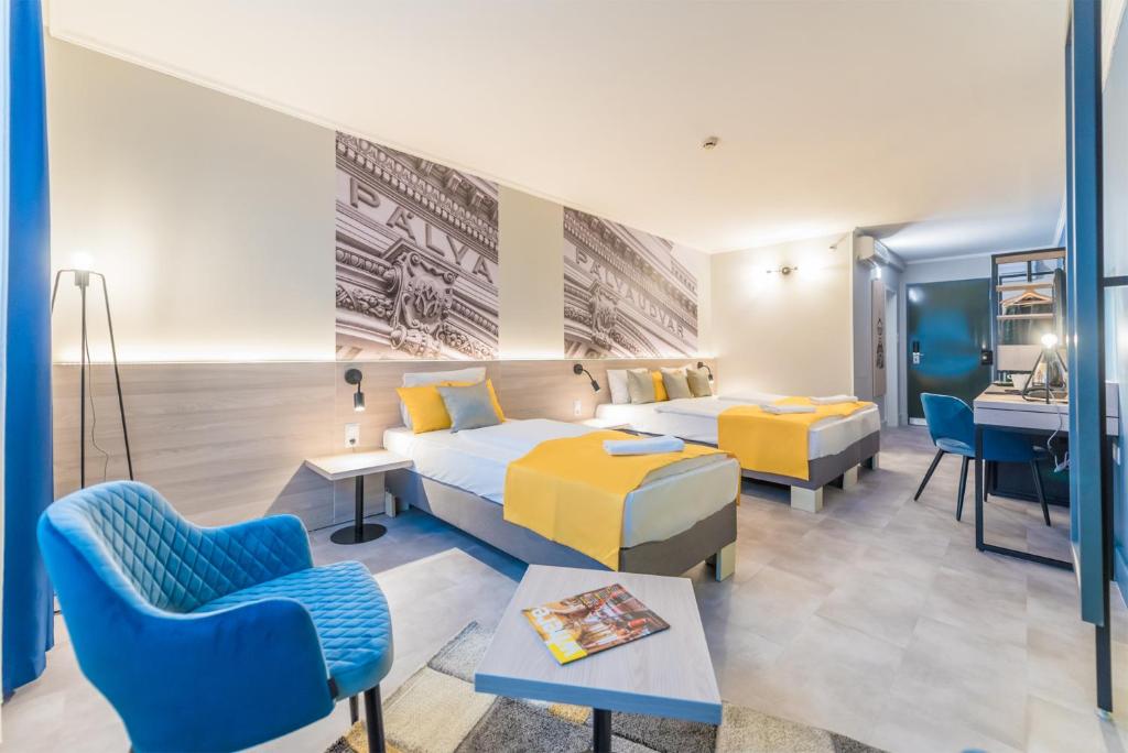 Postel nebo postele na pokoji v ubytování Impulso Fashion Hotel