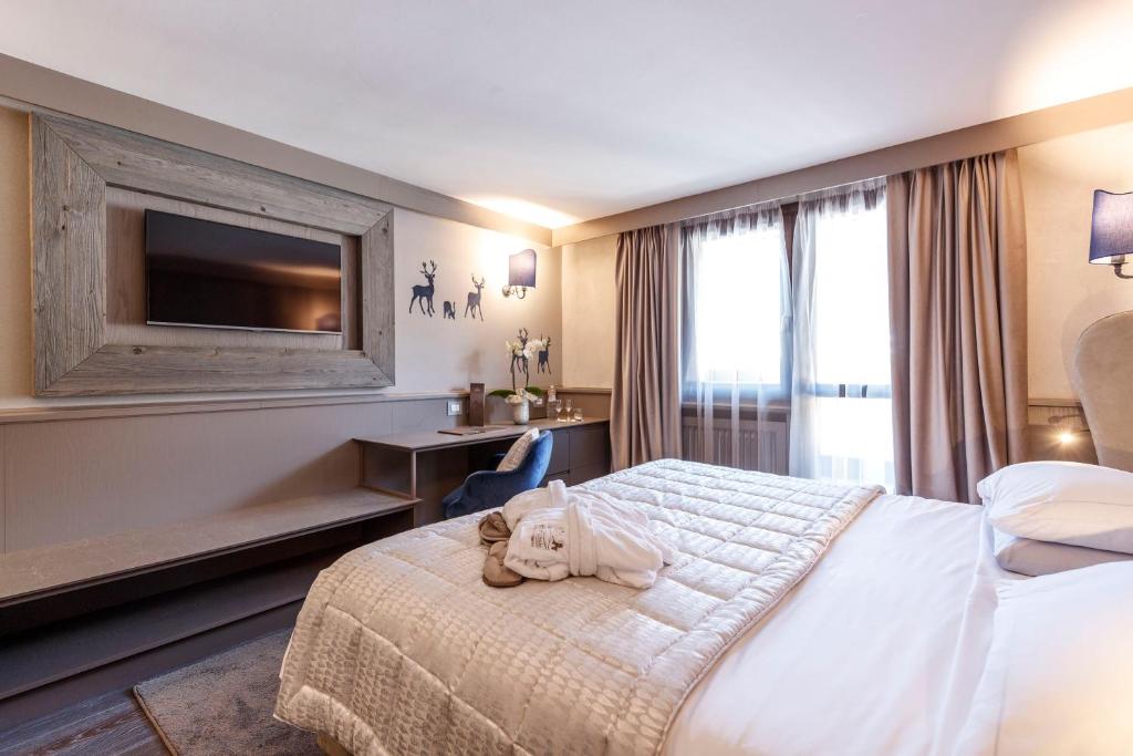 A bed or beds in a room at Hotel Spinale
