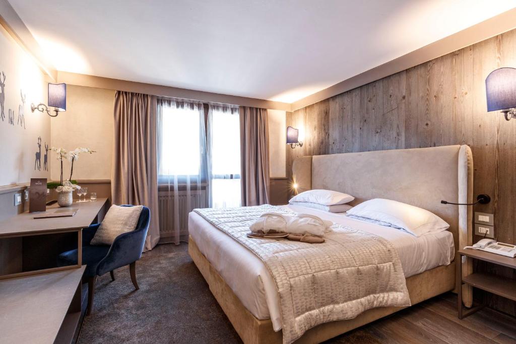 A bed or beds in a room at Hotel Spinale