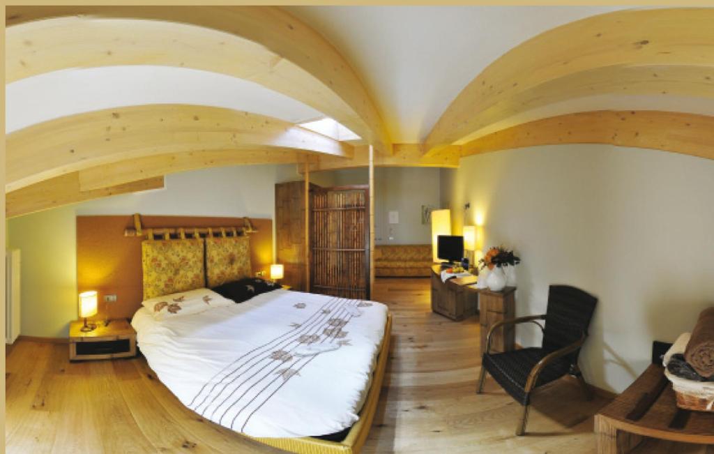 Postel nebo postele na pokoji v ubytování Bio Hotel Brusago Vital & Wellness