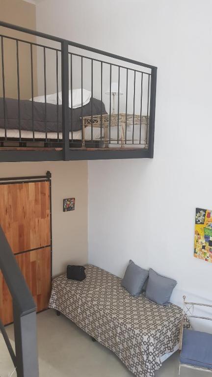 Cama o camas de una habitación en Antigua Fonda Duplex Studio