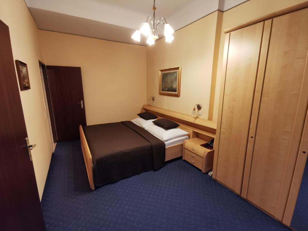 Postel nebo postele na pokoji v ubytování Hotel Bajazzo