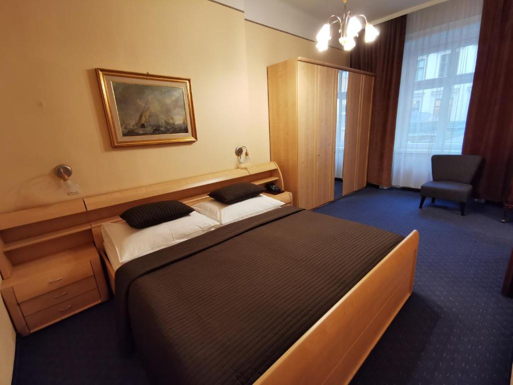 Postel nebo postele na pokoji v ubytování Hotel Bajazzo