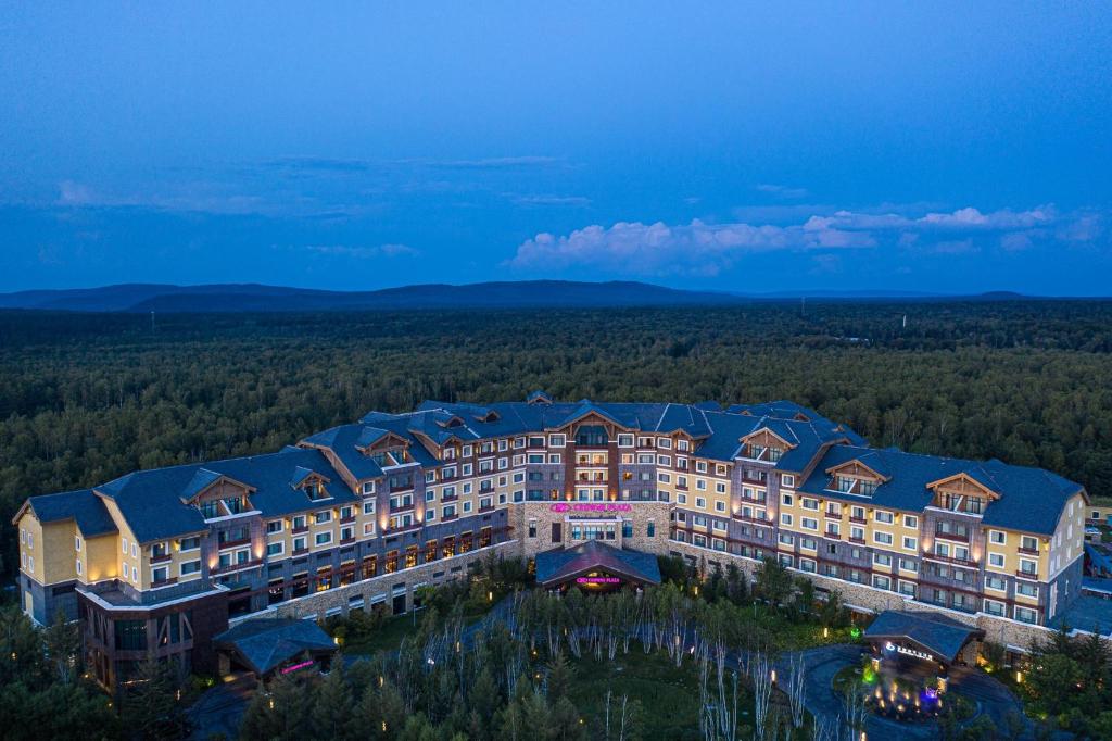 an aerial view of a resort in the woods at Crowne Plaza Resort Changbaishan Hot Spring, an IHG Hotel in Antu
