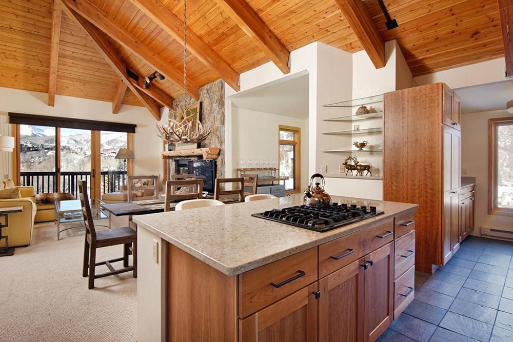 a kitchen with a stove top oven in a room at 229 Faraway The Ridge #36 condo in Snowmass Village