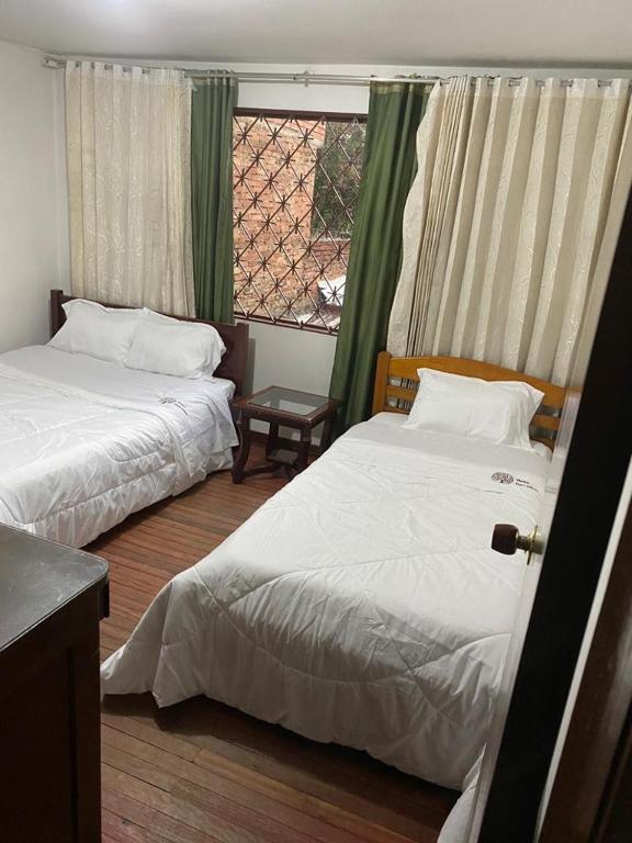 Postel nebo postele na pokoji v ubytování Hotel Don Olivo