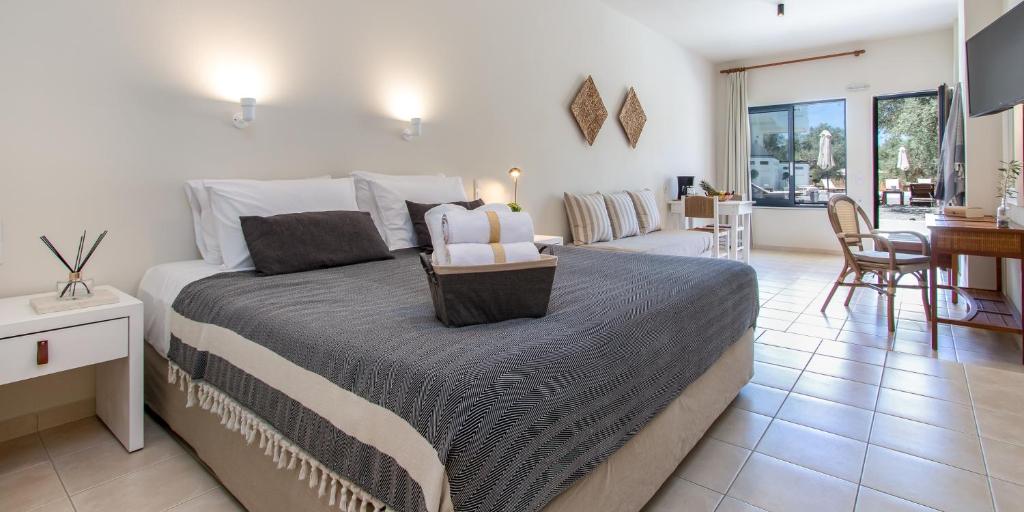 Postel nebo postele na pokoji v ubytování Kanso Rooms