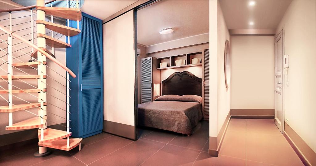 Posteľ alebo postele v izbe v ubytovaní Cala del Porto Residence