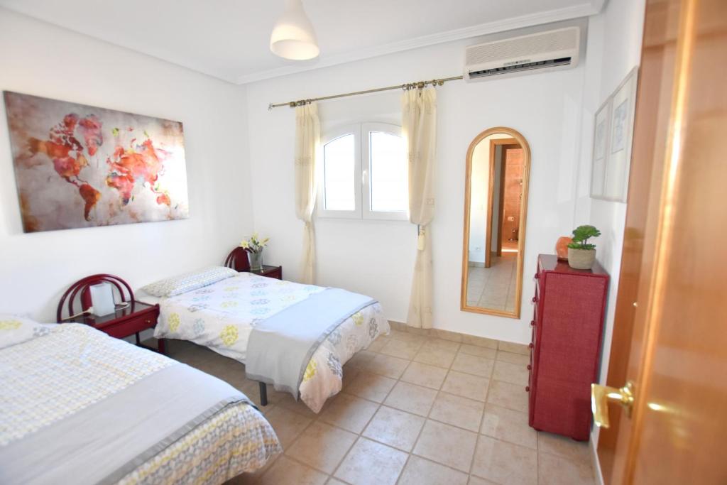 Postel nebo postele na pokoji v ubytování Casa Davagh Javea