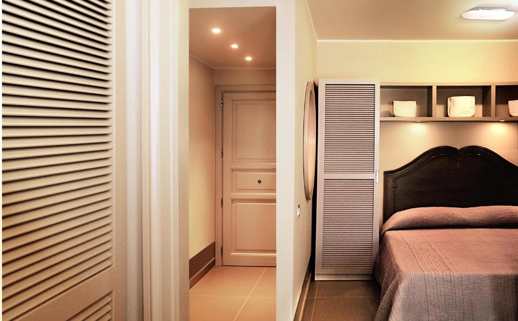 Posteľ alebo postele v izbe v ubytovaní Cala del Porto Residence