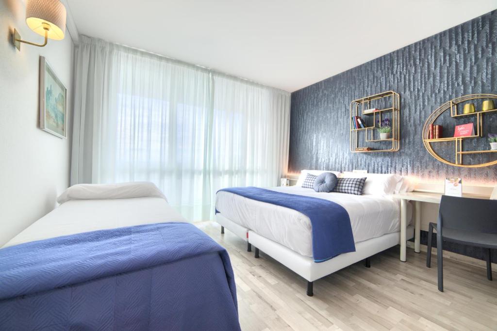 Postel nebo postele na pokoji v ubytování Hotel Luze El Villa