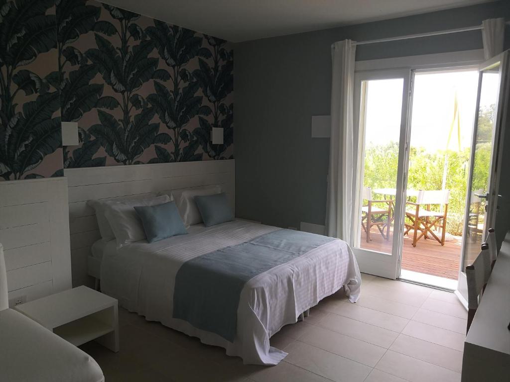 Postel nebo postele na pokoji v ubytování Stile libero b&b