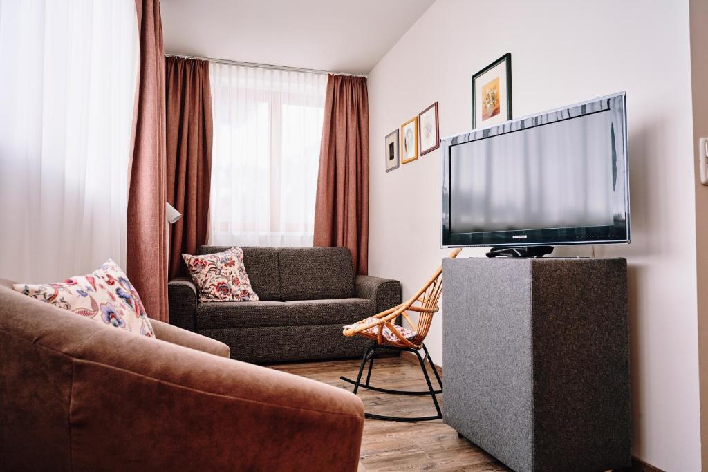 TV a/nebo společenská místnost v ubytování Der Tannenhof