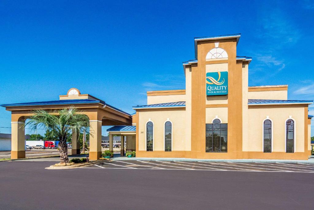 a building with a sign on it in a parking lot at Quality Inn & Suites in Lake City