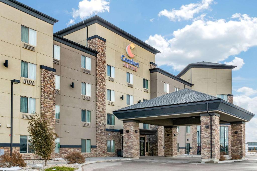 a rendering of a hotel building with a parking lot at Comfort Suites Saskatoon in Saskatoon