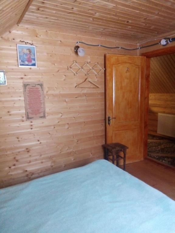 Postel nebo postele na pokoji v ubytování Cottage Лісовий