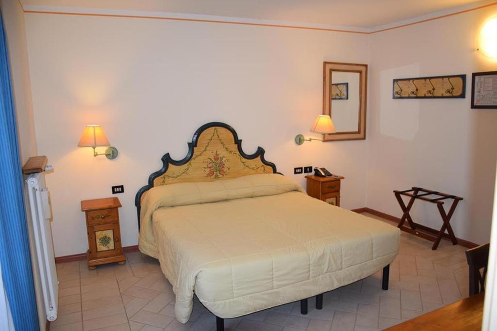 Postel nebo postele na pokoji v ubytování Park Hotel Mater Dei